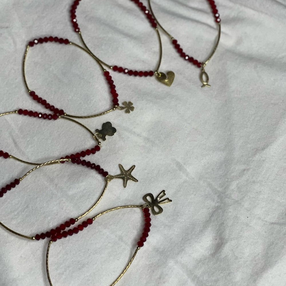 5 bracelets with different symbols